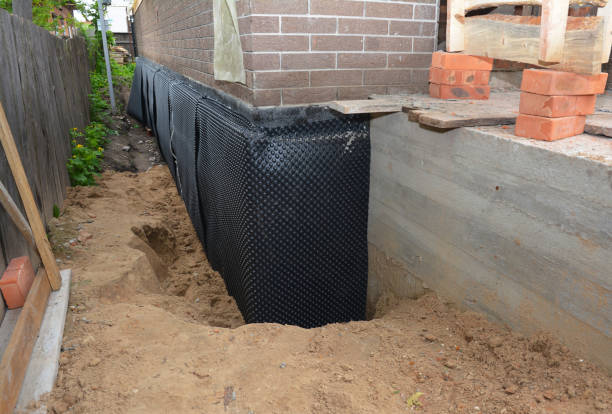 Happy homeowners after waterproofing job in Sandy Spring